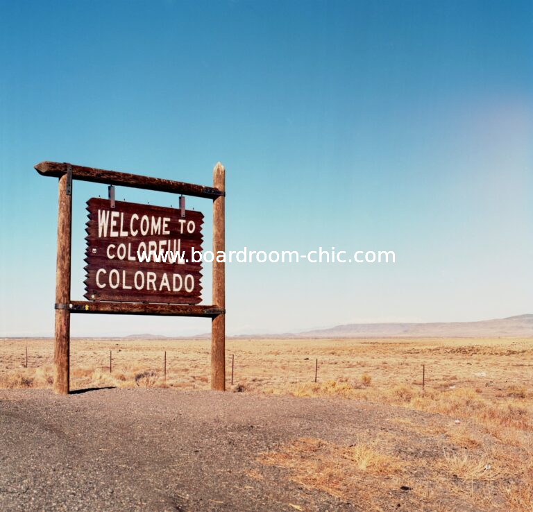 Welcome to Colorado - A scenic welcome sign against a backdrop blue skies, capturing the spirit of adventure in the Centennial State